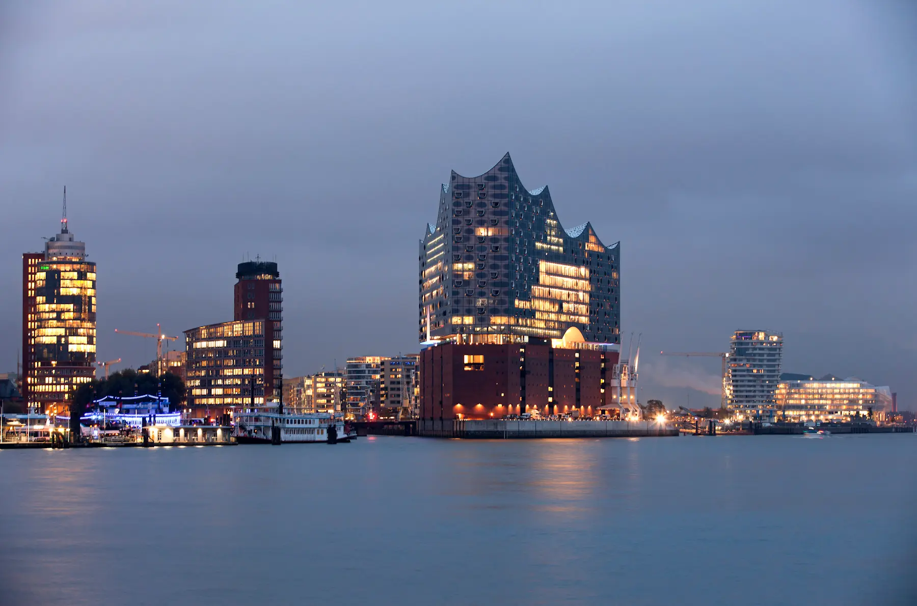 Modern buildings by the waterfront at dusk