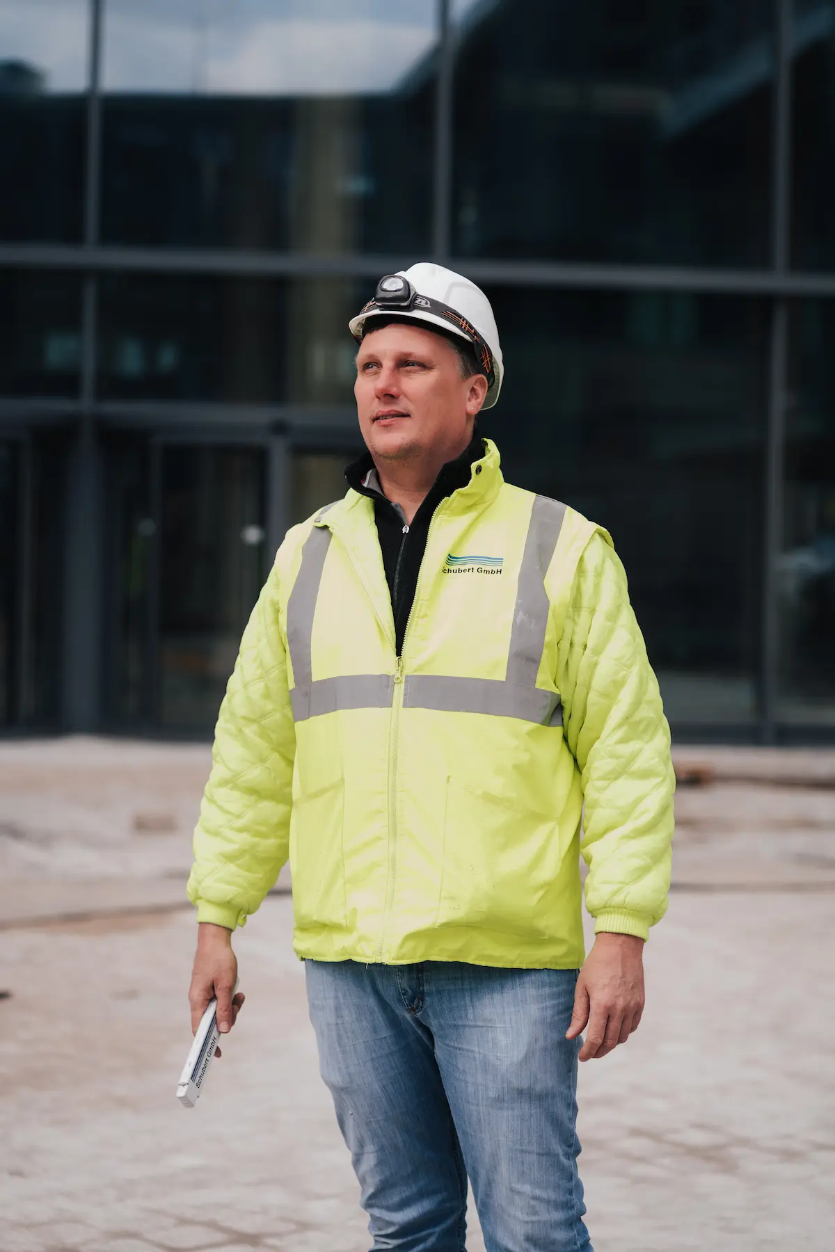 Construction worker in hard hat and safety jacket