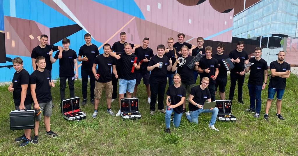 Group of young people with tools outdoors